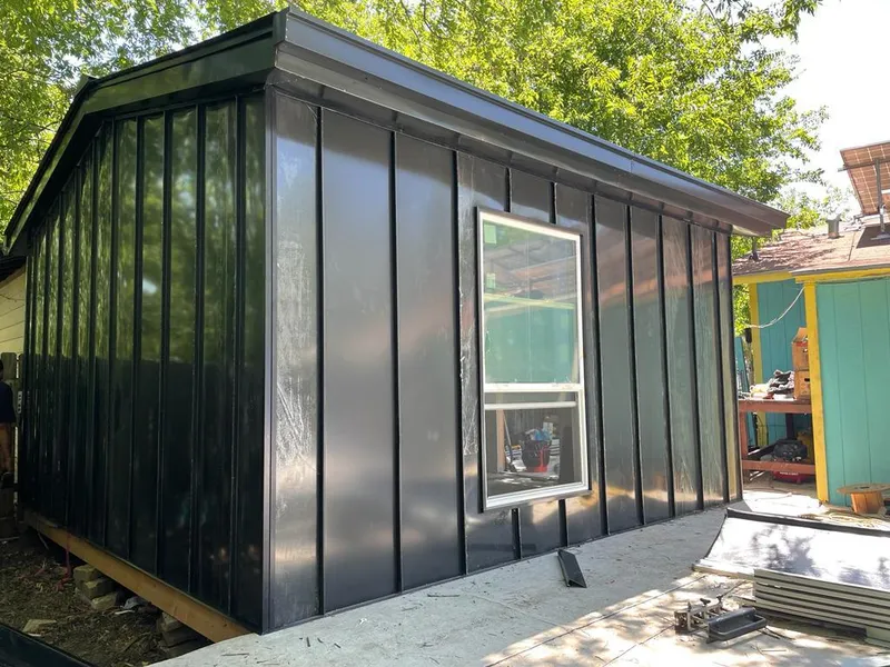 Black standing seam metal wall panels for Roof Inspection in Grantsville